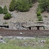 The stone houses of the herdsmen. The mountains are inhabited from May to September, when herdsmen bring their flocks and cattle to the high valleys for grazing.